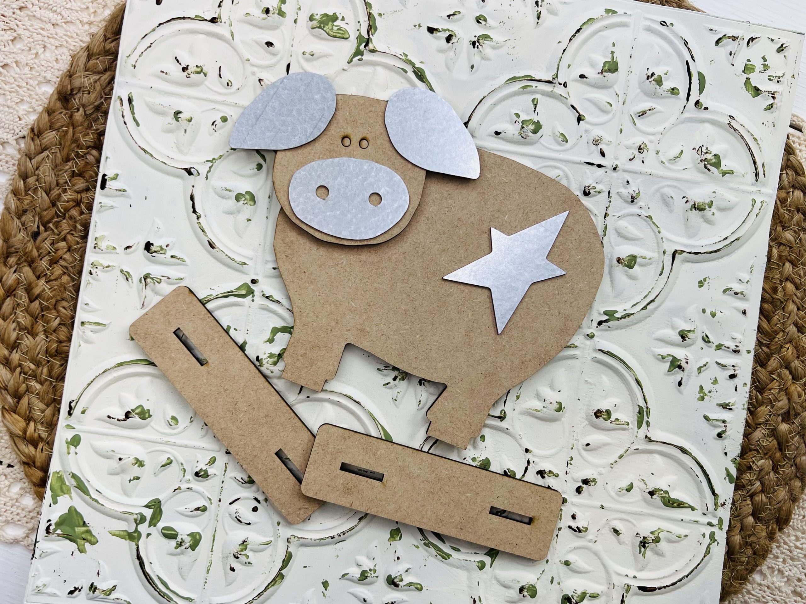 This is a primitive pig wood and metal cutout to craft with