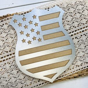 Police badge wood shape with a metal overlay that is easy to paint for a hanger for crafting and diy projects