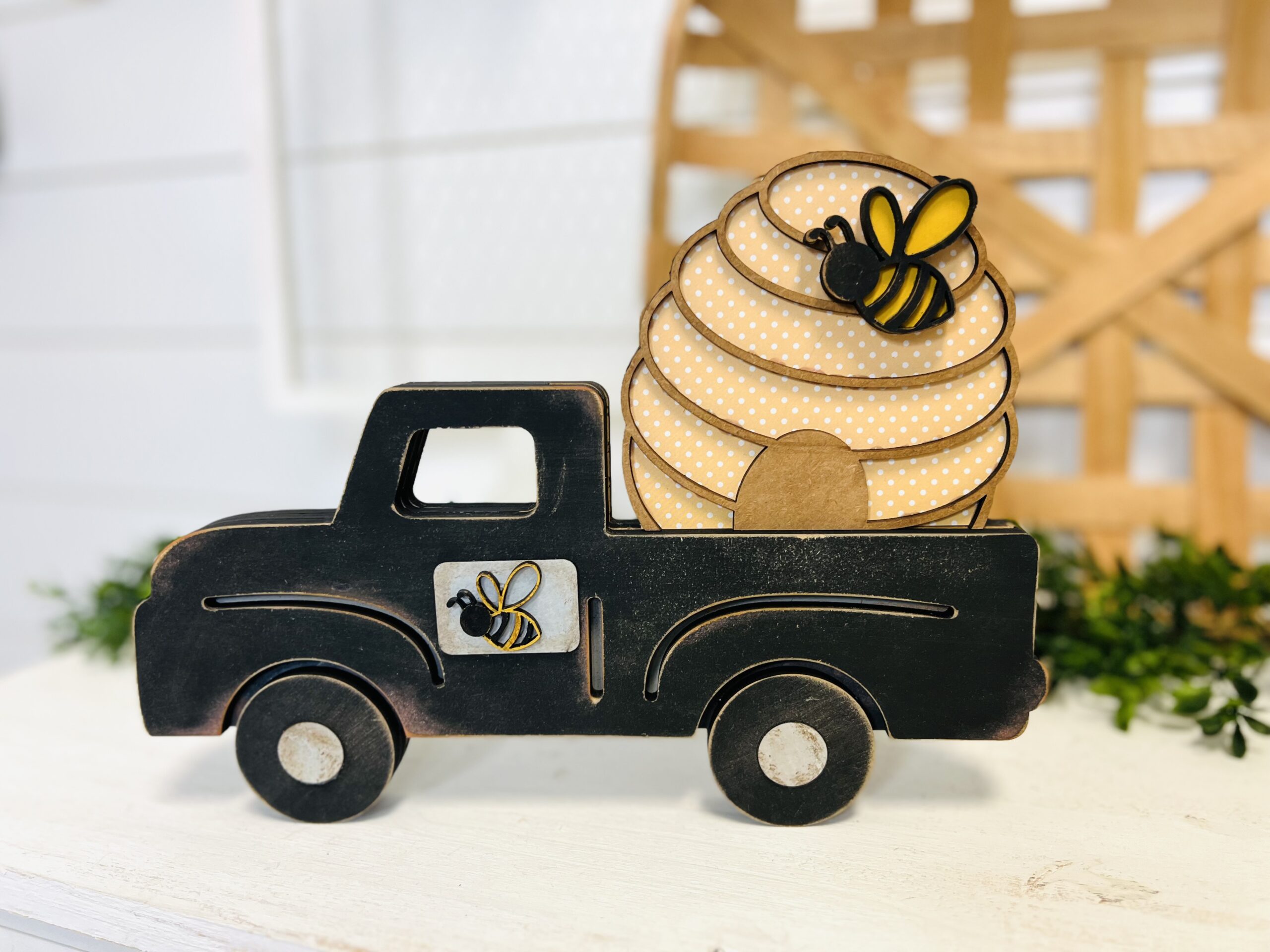 This is a farmhouse truck with an interchangeable bee hive for crafting. This is a finished painted variation of the cutout set.