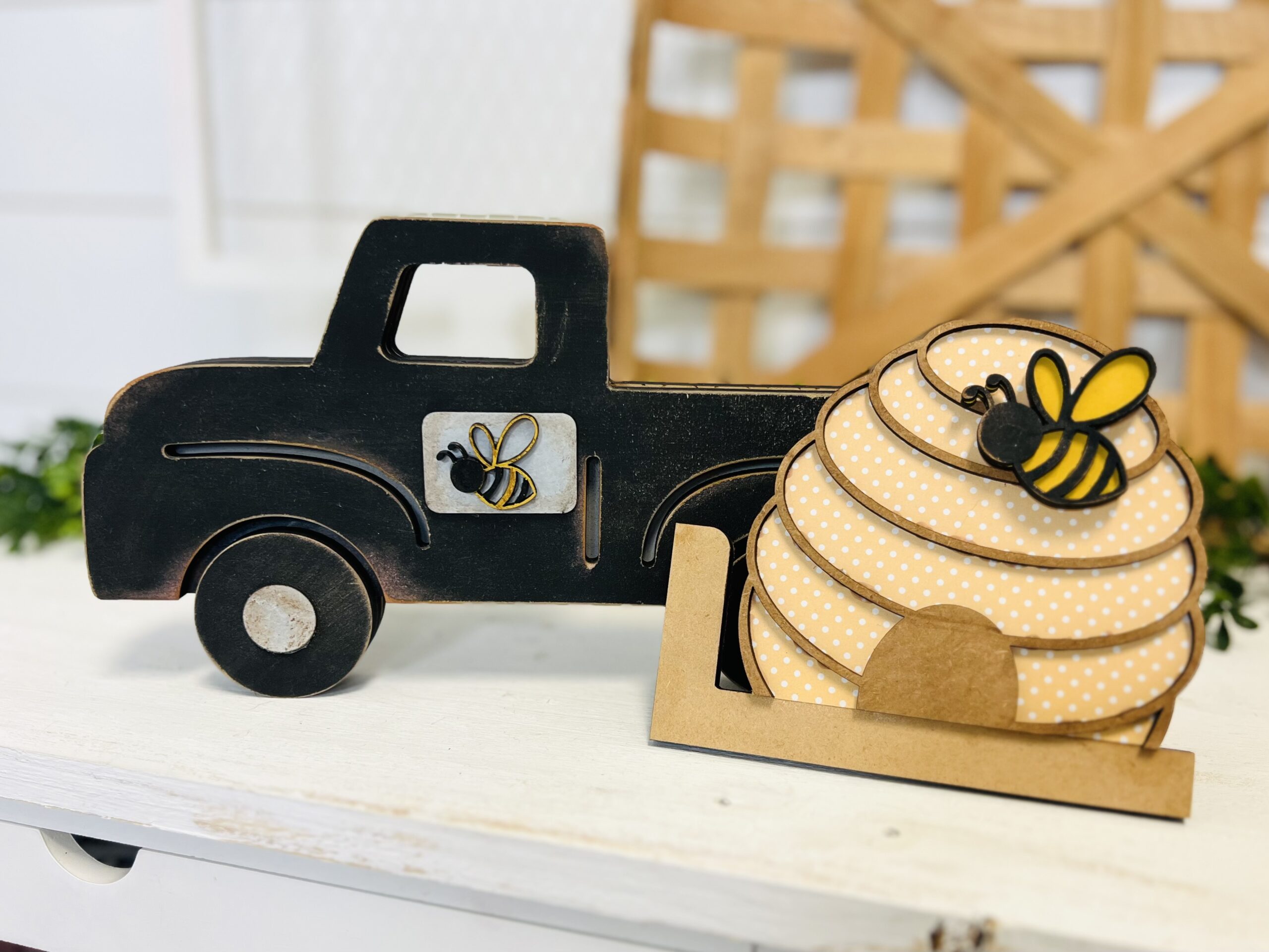 This is a farmhouse truck with an interchangeable bee hive for crafting. This is a finished painted variation of the cutout set.